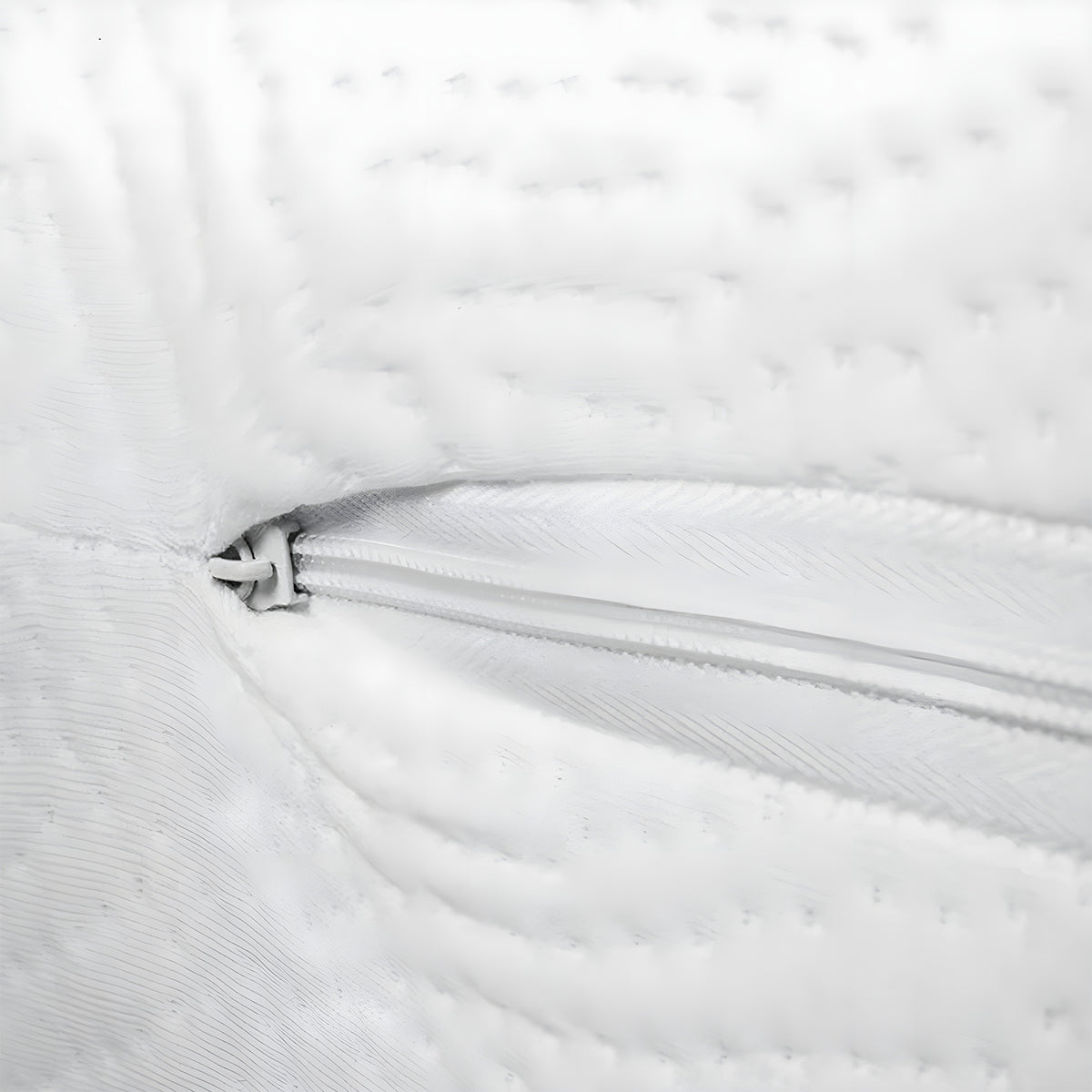 Detailed close-up of the secure zipper on the Orion 2-Stage Crib & Toddler Mattress casing.