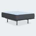 Angled view of the Destin Cove 15 Inch Firm Mattress by Ashley showing the quilted blue and white top cover.