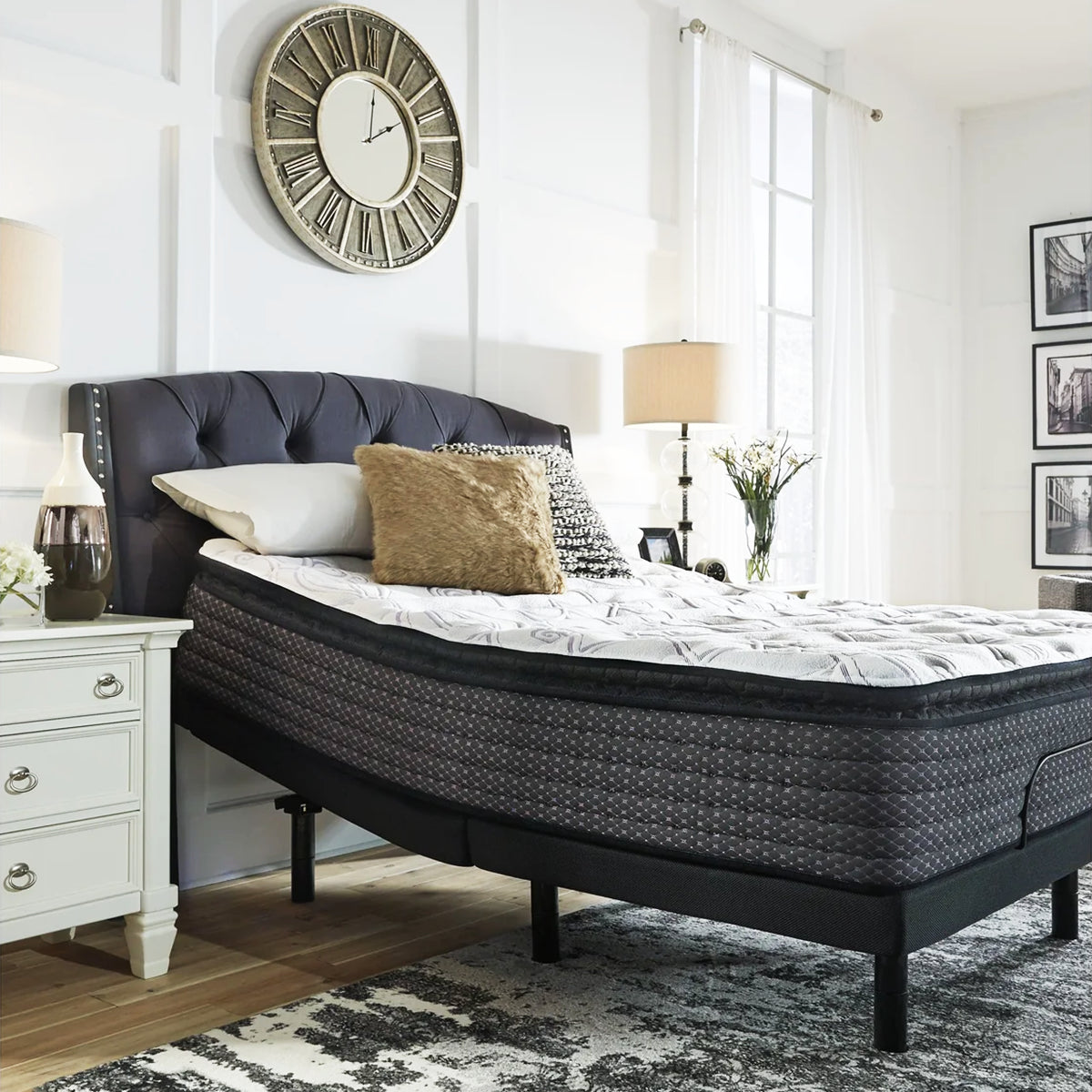 Ashley Sierra Sleep 12 Inch Plush Mattress inclined on an adjustable base for reading or elevated sleeping.
