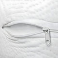 Detail of an open zipper on an organic mini crib mattress showing the breathable inner layers.