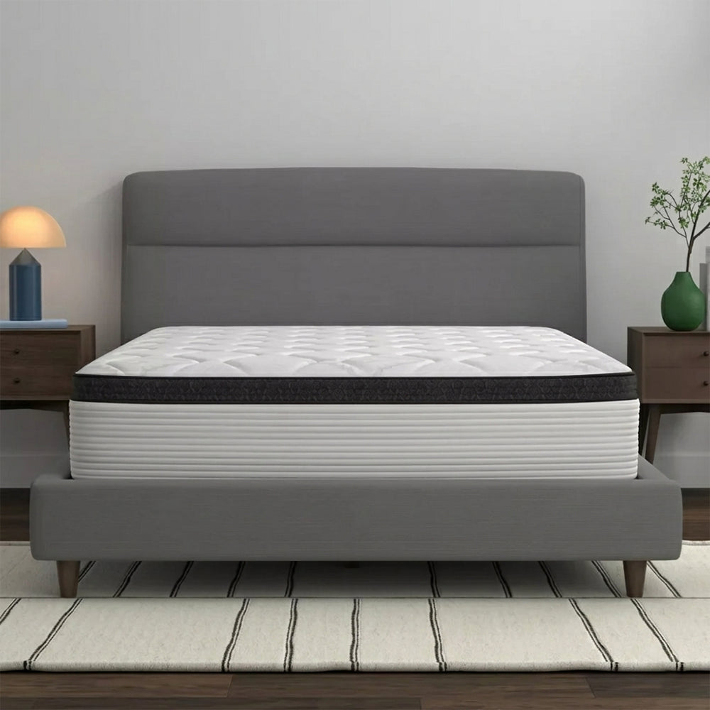 Corner perspective of the American Bedding Cymbal Jingle 12" Hybrid Euro Top Plush Mattress in a modern minimalist bedroom setting.
