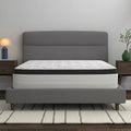 Corner perspective of the American Bedding Cymbal Jingle 12" Hybrid Euro Top Plush Mattress in a modern minimalist bedroom setting.
