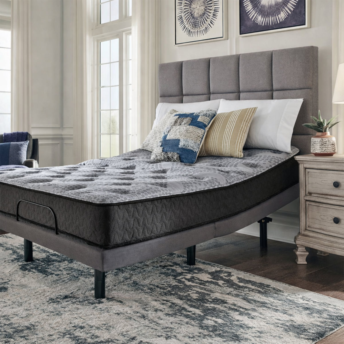 Close-up of the Comfort Plus 10 Inch Medium Mattress highlighting the textured black side fabric and plush surface.