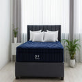 Front-facing view of the premium Phantom Lux 16-inch tight-top mattress with a medium comfort level on a matching grey fabric base.
