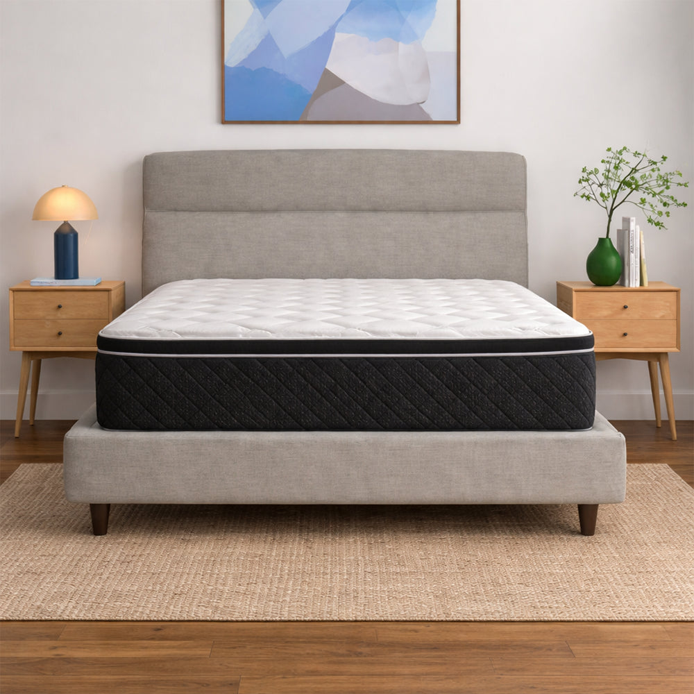Side profile detail of the 14-inch American Bedding Griffin Hybrid Medium Plush Mattress showing the deep comfort layers and diamond-quilted border.
