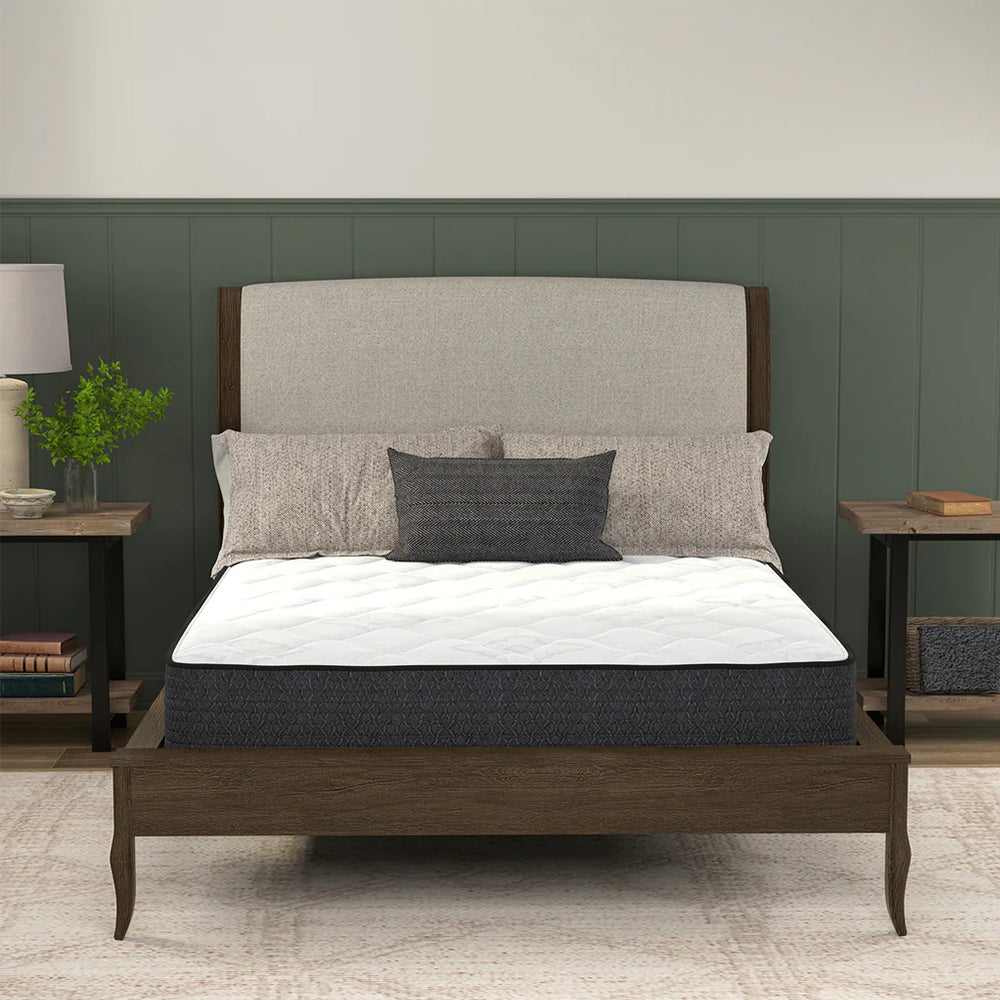 Symmetrical frontal view of the American Bedding Classic 8 Inch Innerspring Mattress in a contemporary bedroom setting for superior back support.
