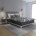 Luxury modern bedroom featuring the Dreamstage 2.0 Calm Hybrid 14" mattress for superior motion isolation and pressure-relieving comfort.
