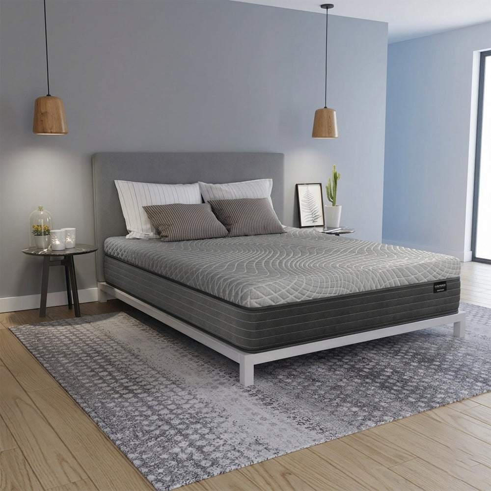 Luxury 12" Dreamstage 2.0 Hybrid Mattress on low-profile white bed frame in bright modern bedroom