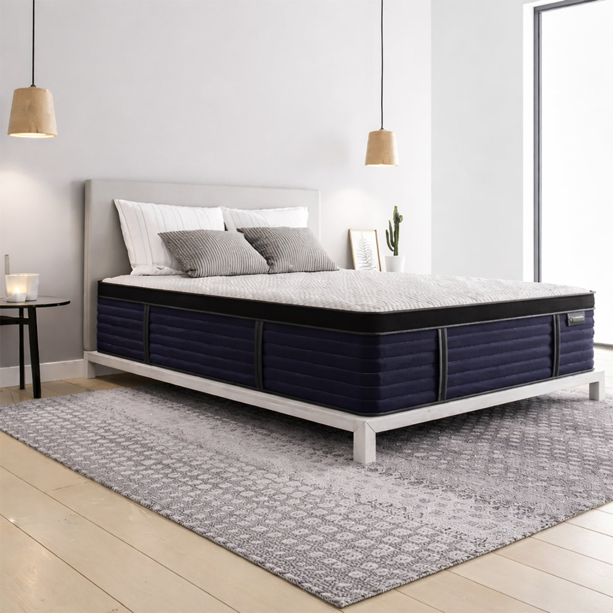 Aspen Cool Latex Hybrid Mattress in bedroom setting styled on a white frame with mid-century lamps.