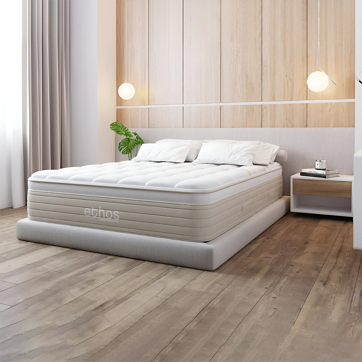 ETHOS Natural Hybrid Mattress in bedroom setting showing the 14.5 inch luxury profile on a grey platform bed.
