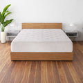 Front view of the SleepFresh 12" Medium Hybrid Mattress on a wood base highlighting the tufted cool-to-touch surface.