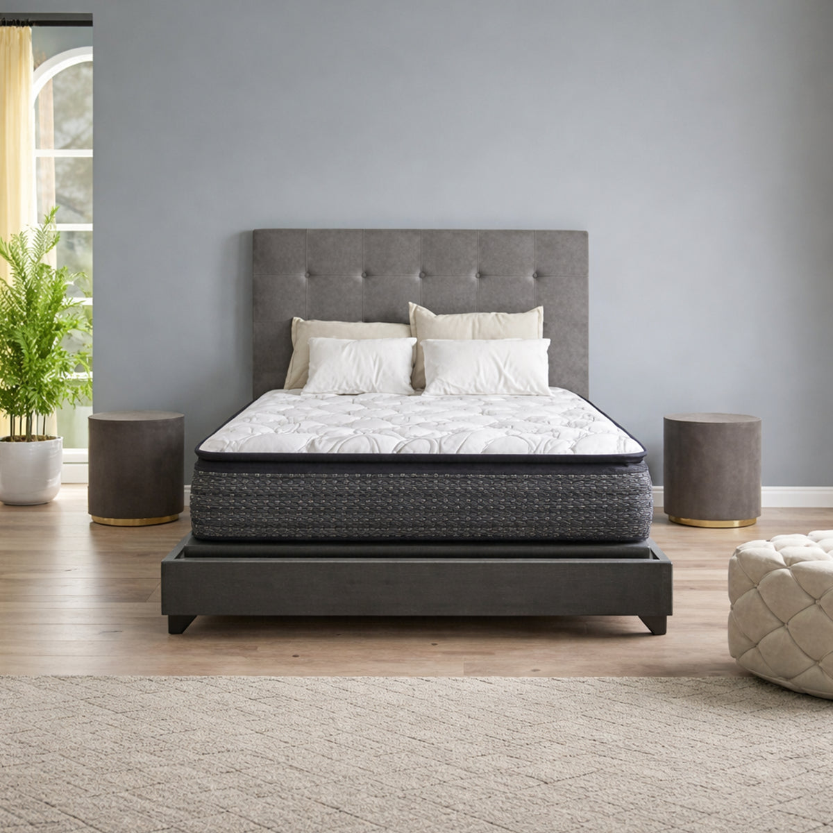 Modern bedroom view of the Sierra Sleep Limited Edition 13.5 Inch Pillow Top Mattress on a grey upholstered frame.