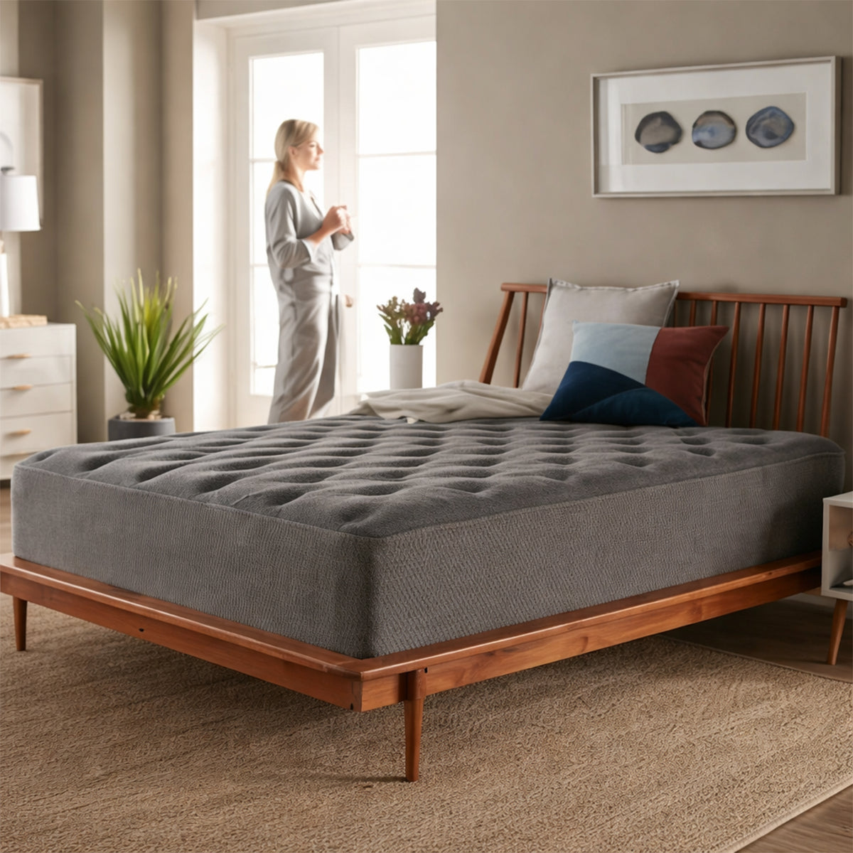 Tommie Copper 14-inch plush hybrid mattress styled with green bedding on a mid-century modern wooden platform bed frame.
