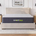 Sleek master bedroom featuring the GhostBed Hybrid Mattress on a neutral upholstered bed frame, styled for a modern aesthetic.

