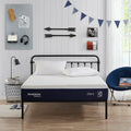 Modern bedroom featuring the Sleeptone 10-inch memory foam mattress styled with white pillows, showcasing its sleek profile and 2-in-1 adjustable firmness.

