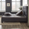 Side lifestyle view of the Malouf M455 power base within a bed frame demonstrating independent head and foot elevation for couples.

