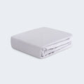 Folded grey Hyper-Wool performance crib sheet by BEDGEAR for a moisture-wicking, breathable nursery.

