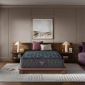 Beautyrest World Class Hybrid Level 4 Plush 13.5 Inch Mattress on a modern wood platform bed in a stylish bedroom.
