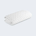Folded BEDGEAR Ver-Tex crib mattress protector featuring instant cooling fabric and a textured heat-deflecting surface.
