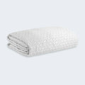 Folded BEDGEAR Ver-Tex mattress protector made with instant cooling fabric to help prevent night sweats.
