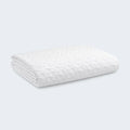 Folded BEDGEAR Dri-Tec sofa bed mattress protector featuring soft, moisture-wicking white fabric.
