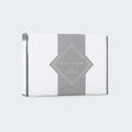 Weekender Jersey Mattress Protector retail packaging by Malouf for durable, waterproof bed protection.
