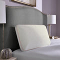 Plush Sleeptone Loft Cool Control pillow propped on a bed, providing luxurious neck and head support.
