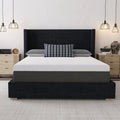 Front view of the South Bay Lavender 12-inch firm gel-infused memory foam mattress on a black upholstered wingback bed frame in a modern bedroom.
