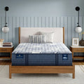 Serta Perfect Sleeper Pro Dublin 14 inch latex hybrid medium mattress in a modern bedroom with a wooden bed frame.