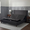 Malouf E455 Split King smart adjustable bed base in a modern bedroom setting with independent motorized head elevation.
