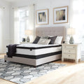 Ashley Chime 12 inch hybrid plush mattress on a stylish upholstered bed for ultimate comfort.
