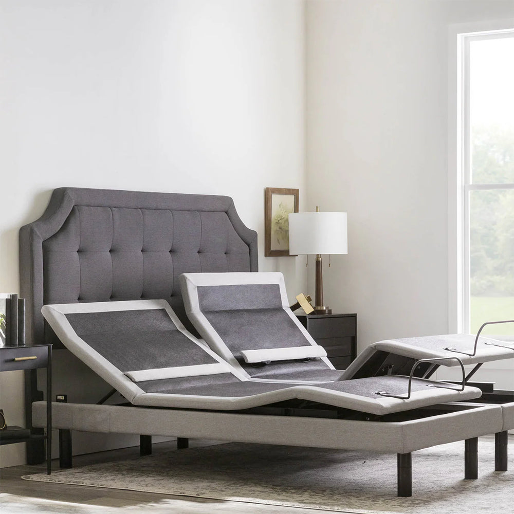 Split King Malouf S755 adjustable bed base featuring independent motorized head and foot elevation in a modern bedroom setting.
