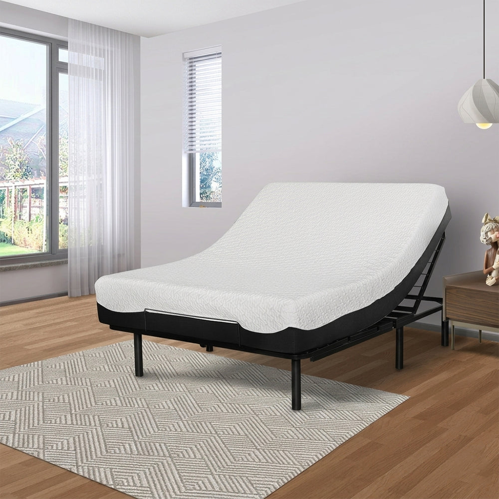 Goto G50 adjustable bed base with independent head and foot incline styled with a white mattress in a modern sunlit bedroom.
