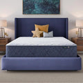 Serta Perfect Day 12 inch Firm Mattress in a Box on a blue bed frame in a modern bedroom.
