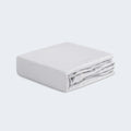 Folded grey Hyper-Linen performance crib sheet by BEDGEAR for a breathable nursery.
