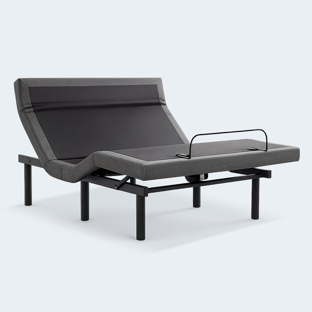 SleepTone S5000 adjustable bed base in an articulated position showing independent head and foot incline with grey fabric upholstery and a black metal frame.
