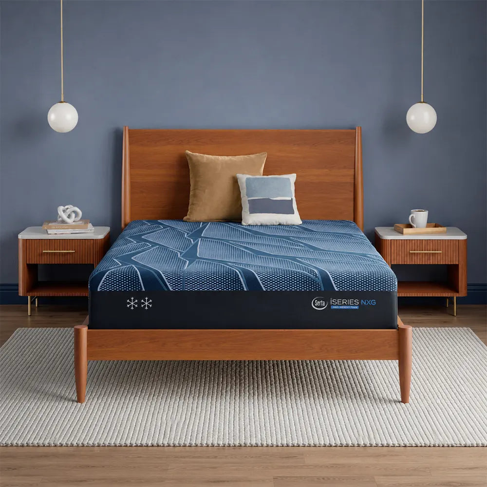 Serta iSeries NXG 2500 12.5-inch plush memory foam mattress on a modern mid-century wooden bed frame.
