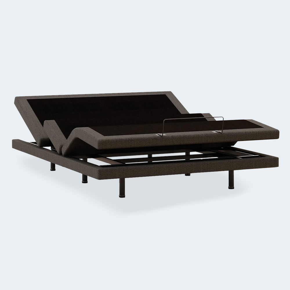 Perspective view of the Comfort Ultra Adjustable Base by Ashley with head and foot sections raised for ergonomic support.
