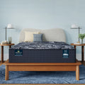 Serta Perfect Sleeper X Excelled Extra Firm 13.75 Inch Hybrid Mattress on a modern wood bed frame.
