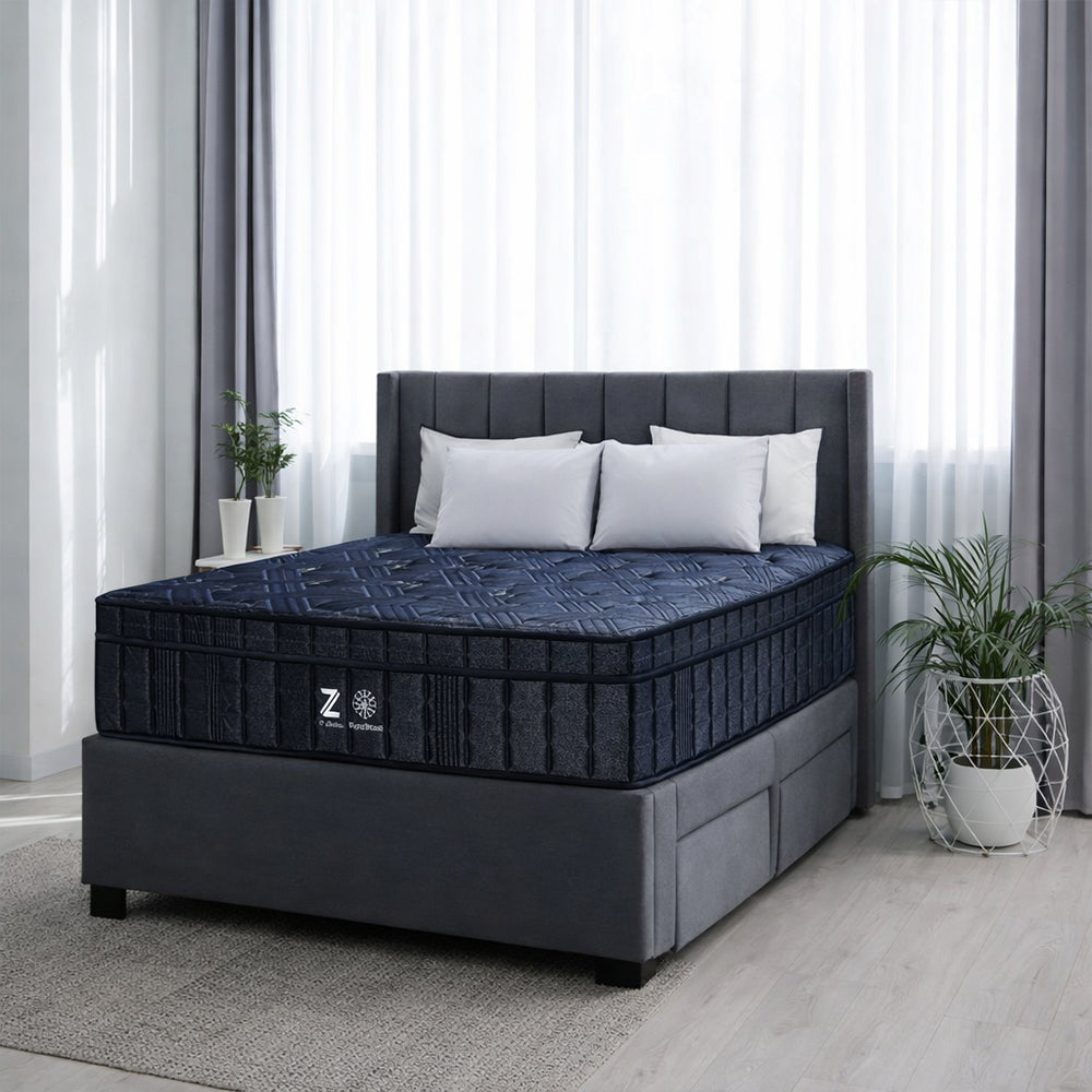 Front-facing view of the high-profile Americanstar Phantom Ultra 16-inch plush mattress featuring a premium charcoal quilted top and navy blue border.
