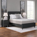 Symmetrical frontal bedroom view of the Ashley Terra Sleep 12-inch mattress elevated on a power base for ergonomic reading and sleeping positions.
