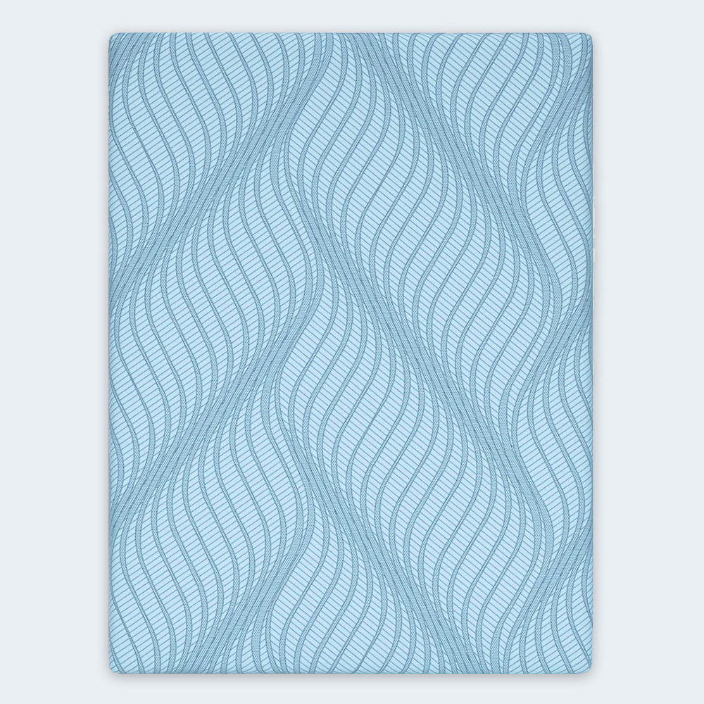 Overhead top-down view of the Peak 2.0 Mattress surface showing the breathable stretch knit fabric and decorative blue wave pattern.
