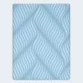 Overhead top-down view of the Peak 2.0 Mattress surface showing the breathable stretch knit fabric and decorative blue wave pattern.
