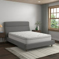 Corner angle shot of the American Bedding Cymbal Jingle 10" Hybrid Euro Top mattress in a contemporary bedroom setting for firm back support.
