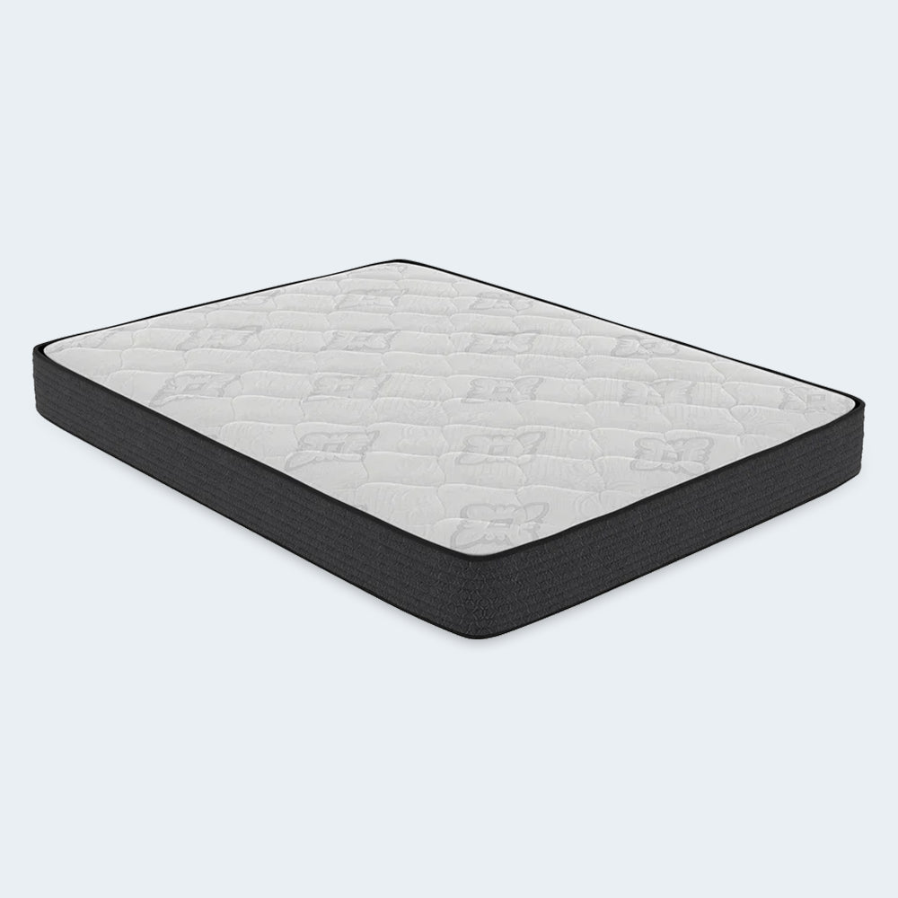 Perspective studio shot of the American Bedding Classic 8 Inch Innerspring Mattress by Corsicana showing the full quilted surface and support profile.
