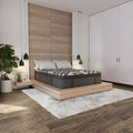 Luxury modern bedroom setting with the 15-inch Dreamstage 2.0 Calm Quilted mattress styled on a minimalist light wood platform bed frame.
