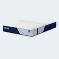 Side-angle studio perspective of the Nectar Classic Hybrid 12" mattress highlighting the premium white quilted top and durable navy blue side panels.
