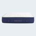 Studio shot of the Weekender Medium 11-Inch Hybrid Mattress featuring a white quilted surface and navy blue vertical channel-quilted side panels.

