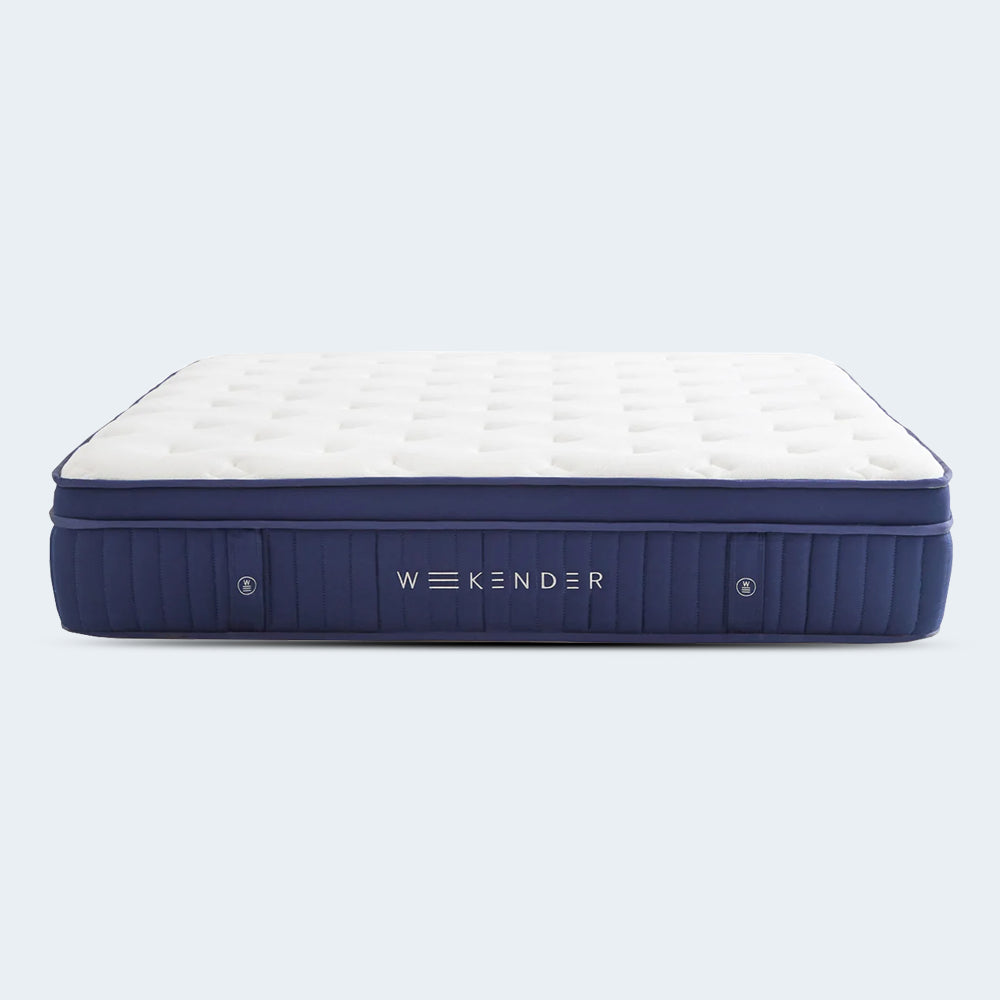 Isolated front-facing view of the Weekender 13-inch hybrid mattress with a white quilted top and navy blue channel-quilted side panels.
