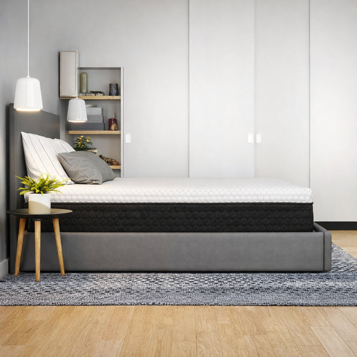 Side view of the Response Copper 12 inch mattress in a minimalist bedroom with neutral decor and lighting.